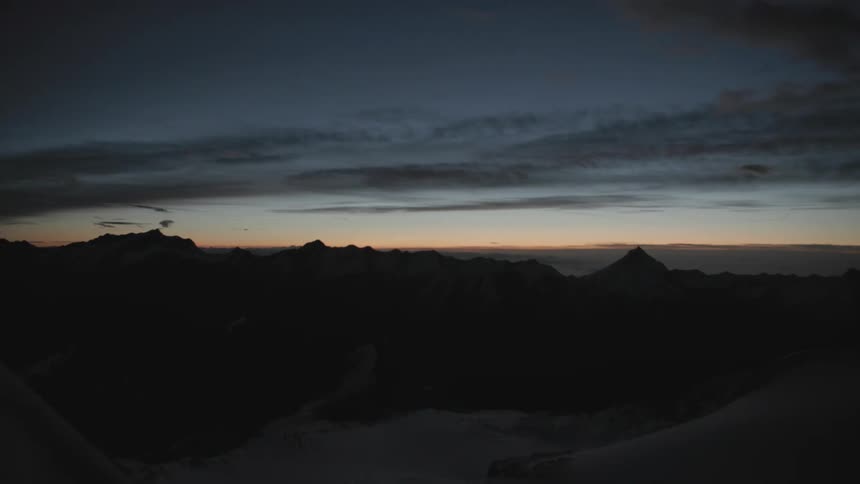 Clouds over a mountain range at dusk
