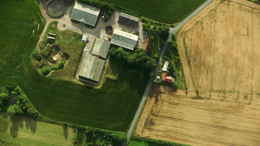 Aerial top down view of farms in the farmland at daytime