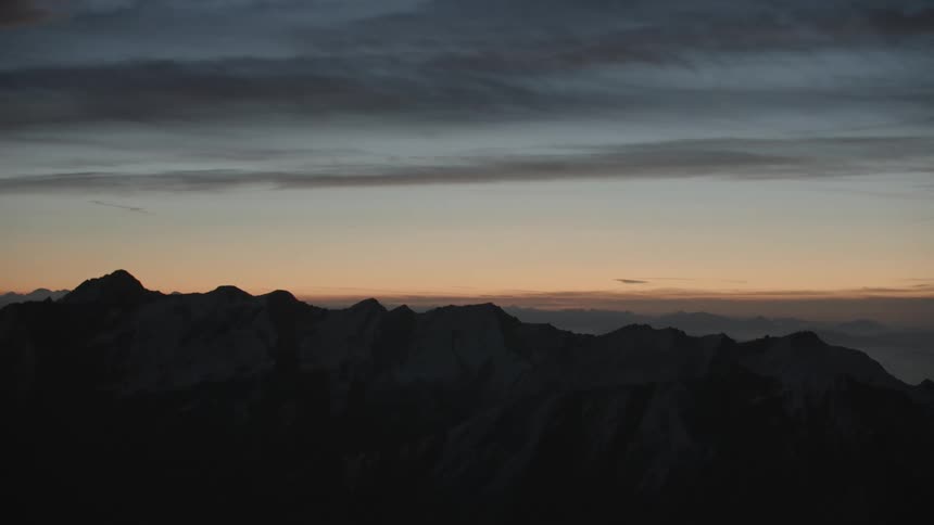 A view of a mountain range at sunset