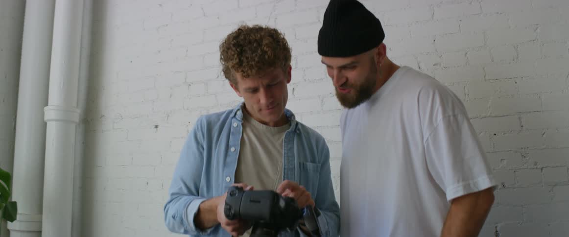 Photographers looking at camera