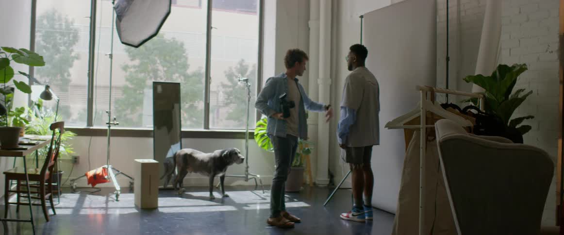 Two men in a photography studio getting ready for a shoot