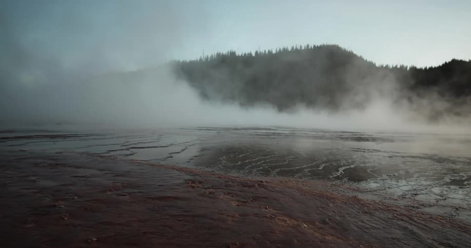 Steam is rolling over the wet ground
