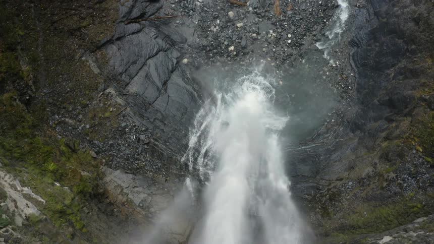 Waterfall cascades down the cliff