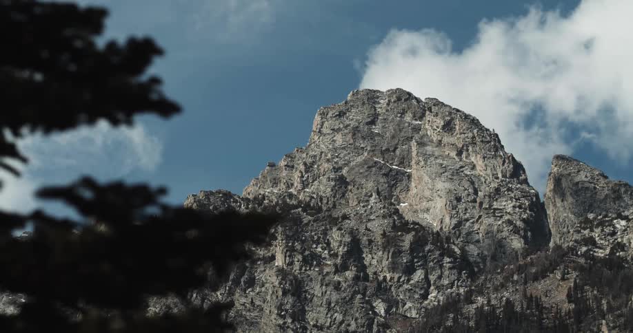 A mountain ridge high in a cloudy sky