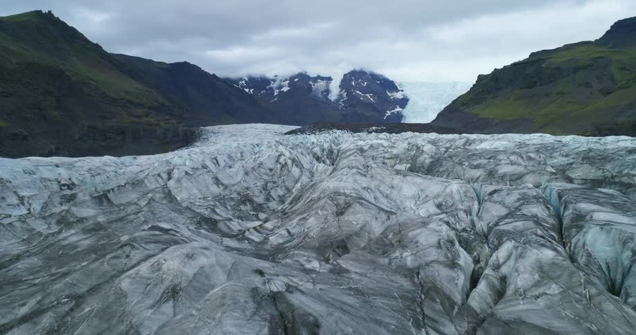 The river is frozen between the mountains