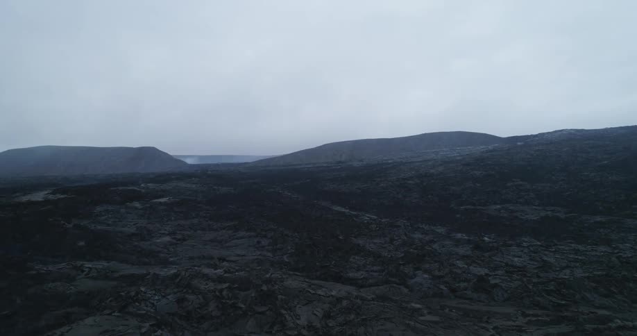 Thick fog settles over an open field
