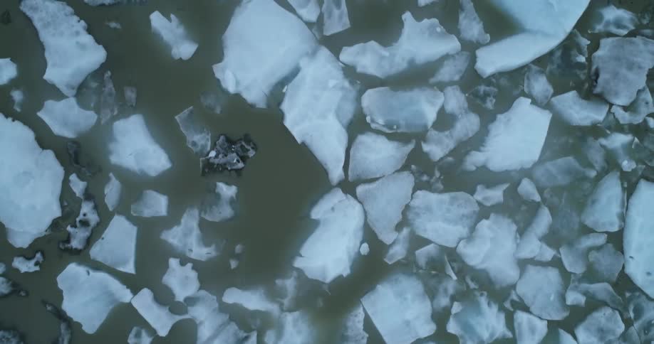 Broken chunks of ice float the the top of the sea