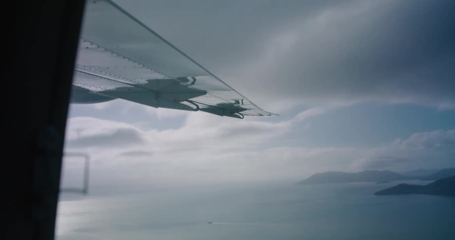 An aerial view of the ocean flying from a plane