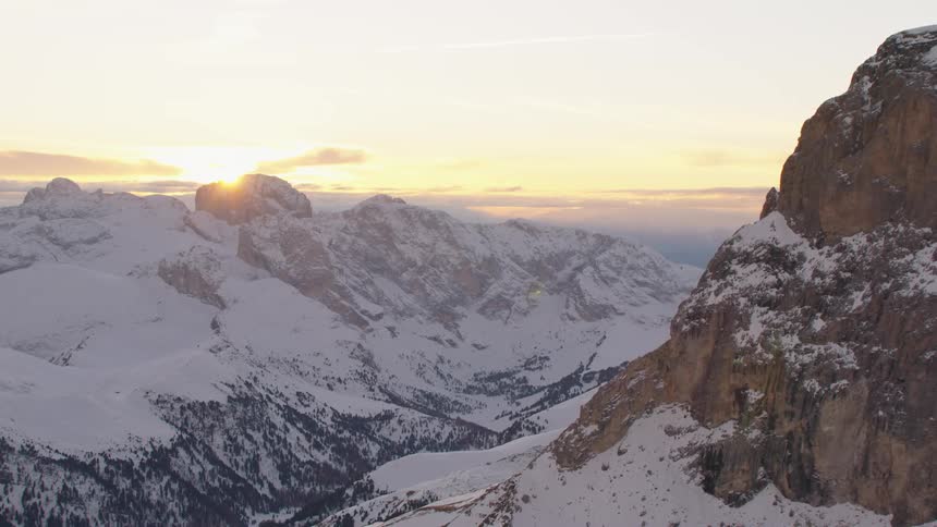The sun is rising on the mountain range