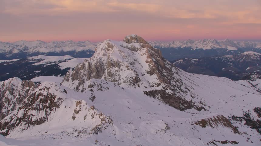 An aerial view of a mountain with a lot of snow on it