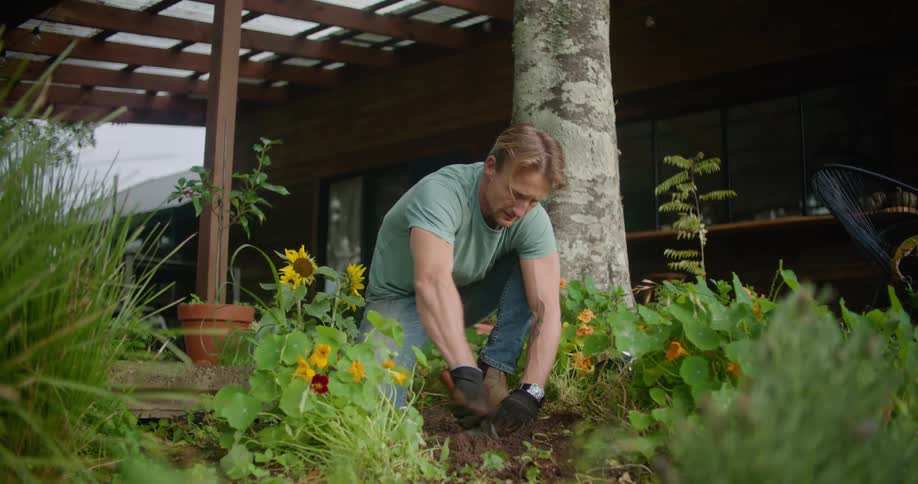 A man is gardening outdoors in spring