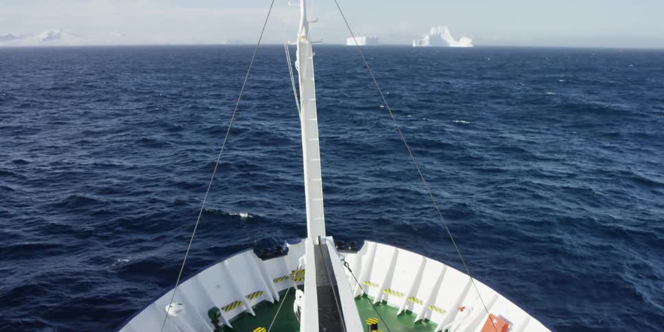 Aerial view of a ship sailing in the water