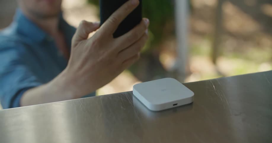 A man scans his phone on the device