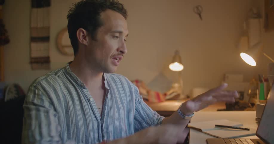 A man is talking with someone on his tablet