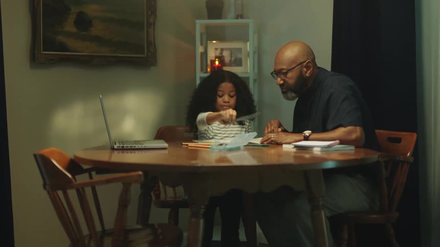 A girl is getting help with her homework