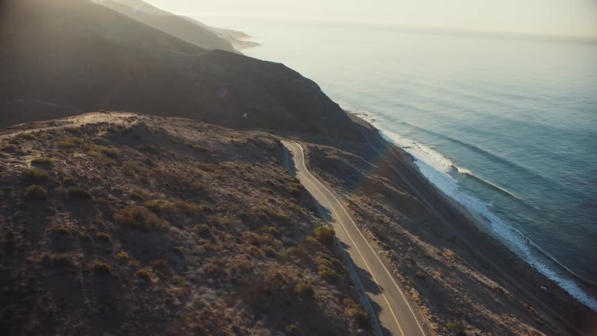 Coastal mountain road at sunrise