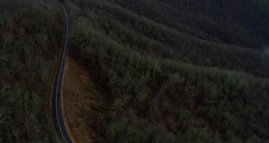 The road runs through the mountain range