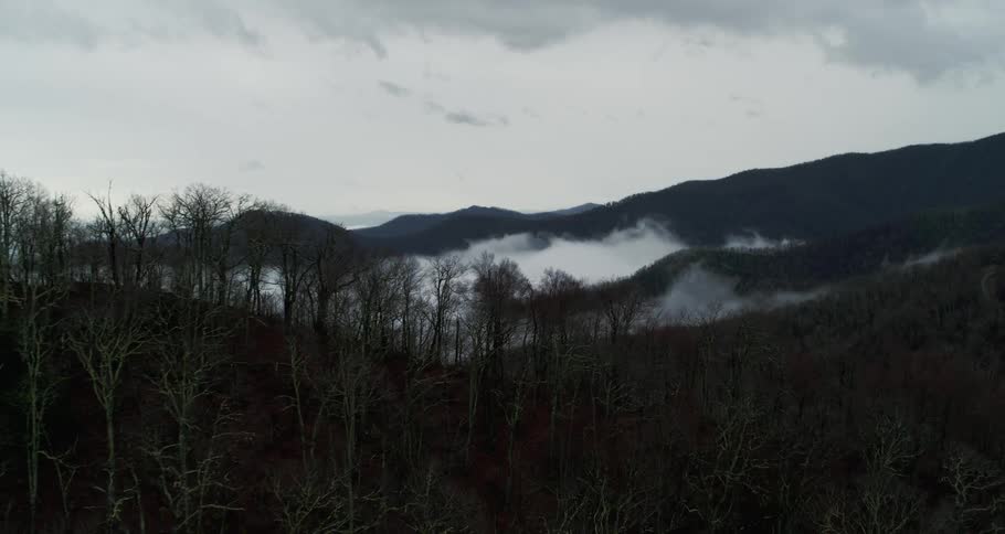 Heavy fog flows over the mountains