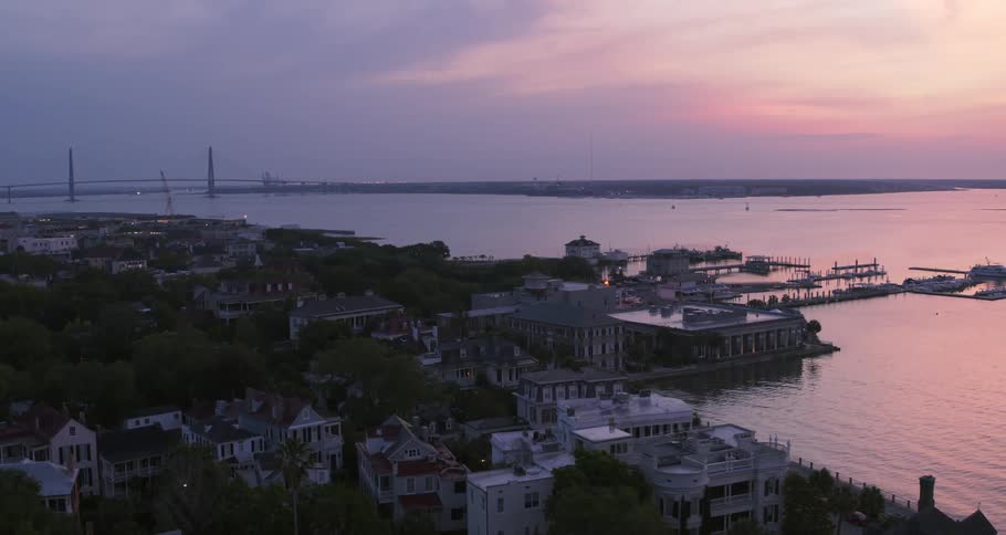 The sun is setting on the coastal town