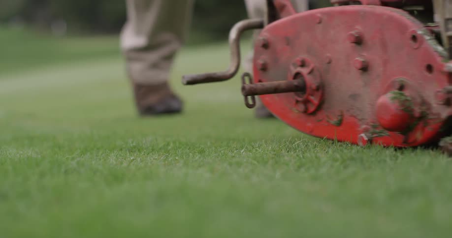 Landscaper Mows Golf Course