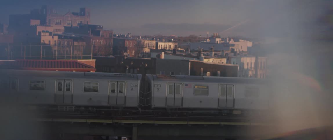A train travels on its track in a big city