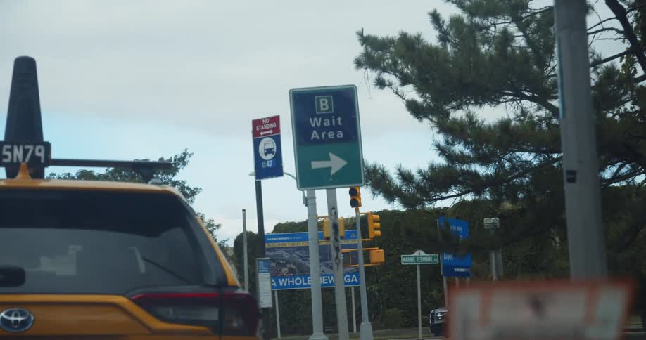 Traveling inside a car while in heavy traffic in a city on an overcast day