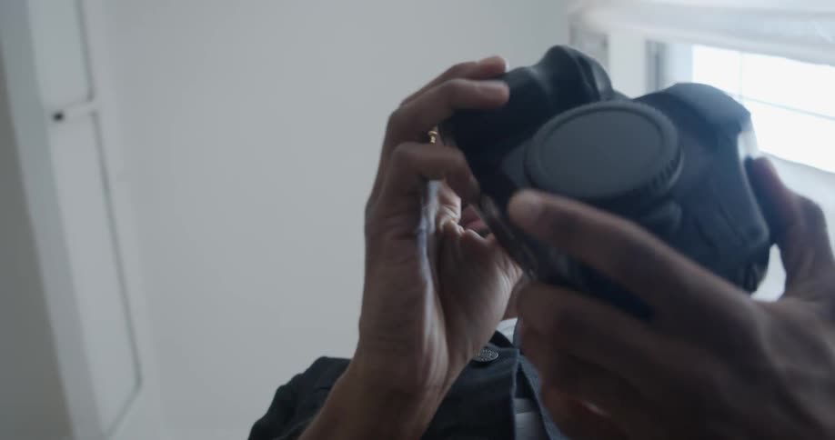 A man checks his camera