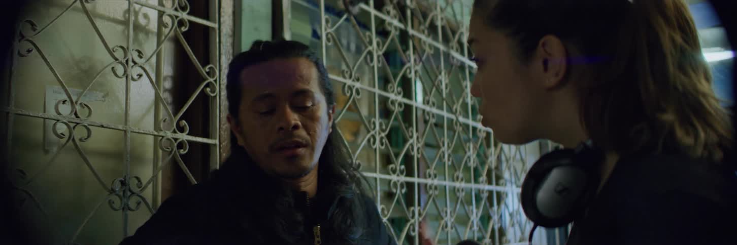 A actor is getting direction on set