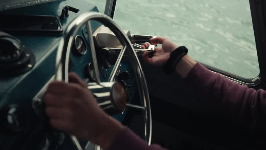 A person piloting a boat