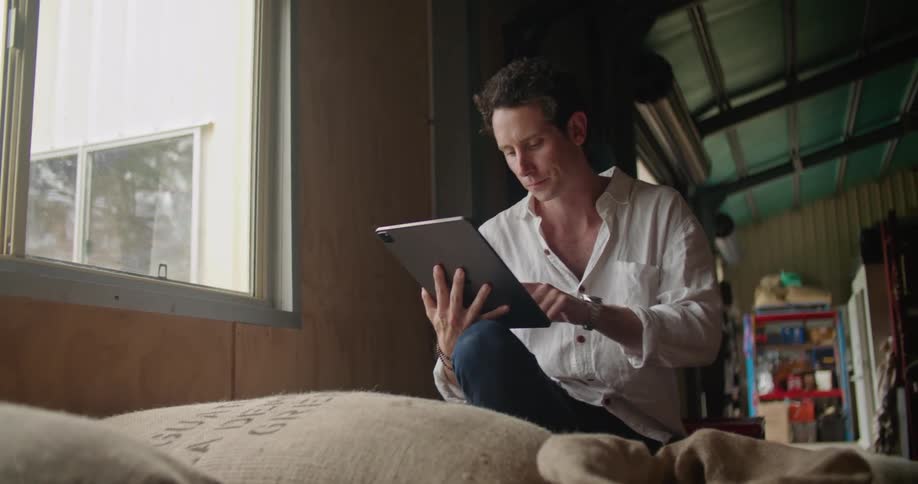Man typing on ipad
