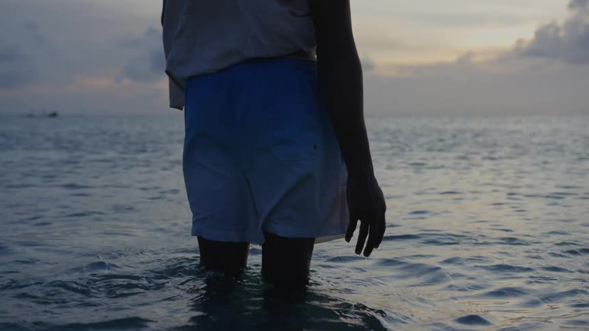 A person standing in the ocean