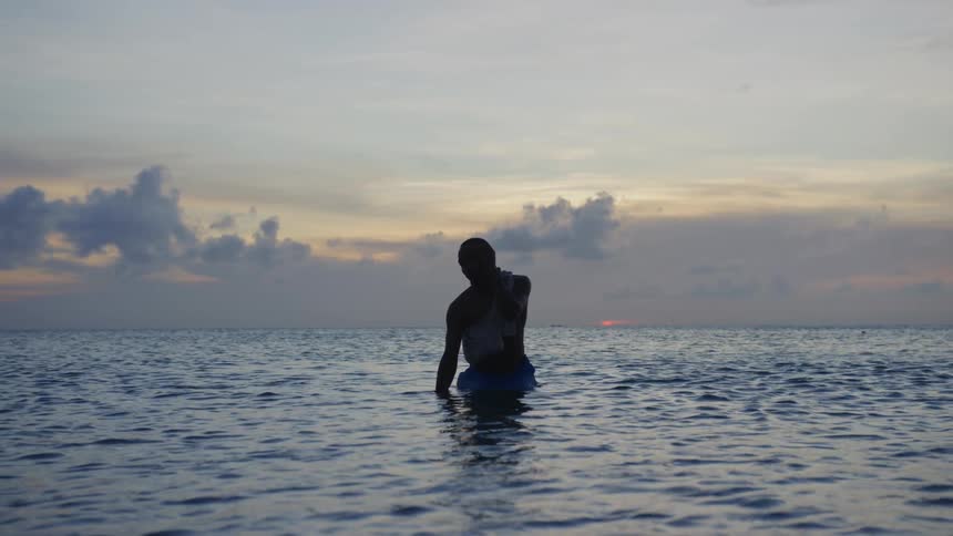 A man stretching in water