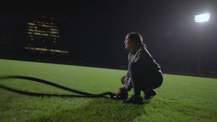 A group of people all exercising on a field