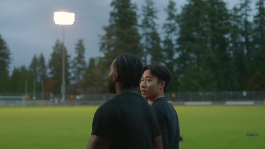 Two friends walk on the track together