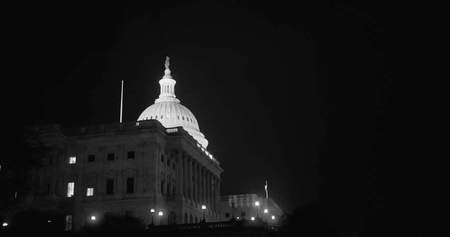A static night shot of the capitol building