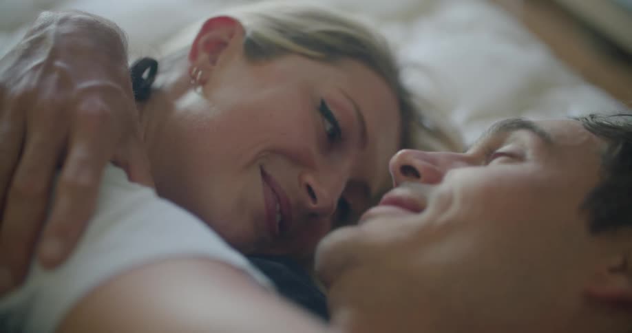 People lying on bed