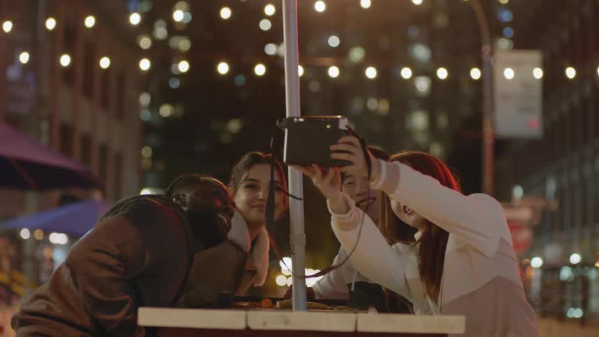 Friends pose together for a selfie