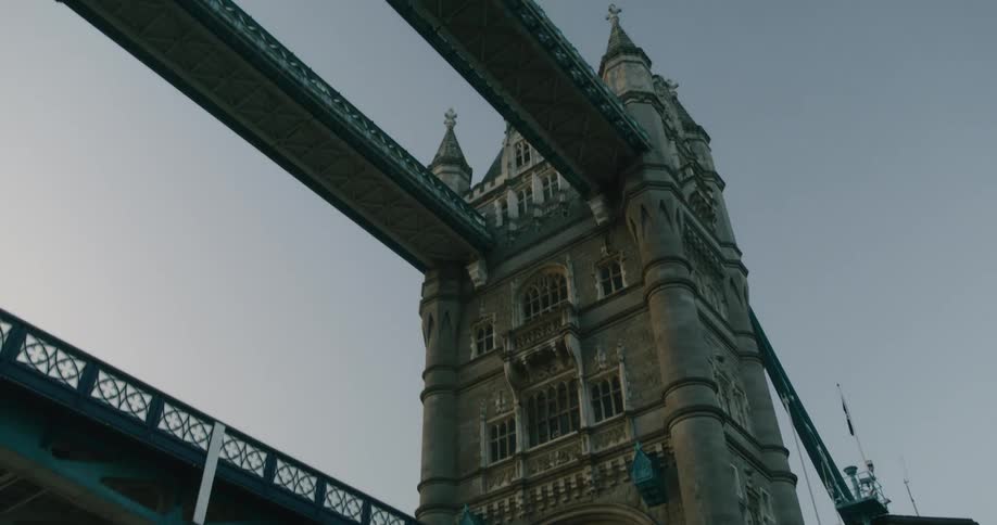 Passing under the tower bridge on the river thames in london at evening