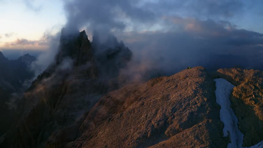 Mountain range with peaks high in the clouds