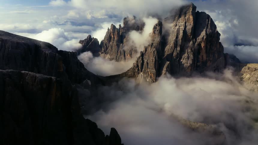 The mountain reaches high into the clouds