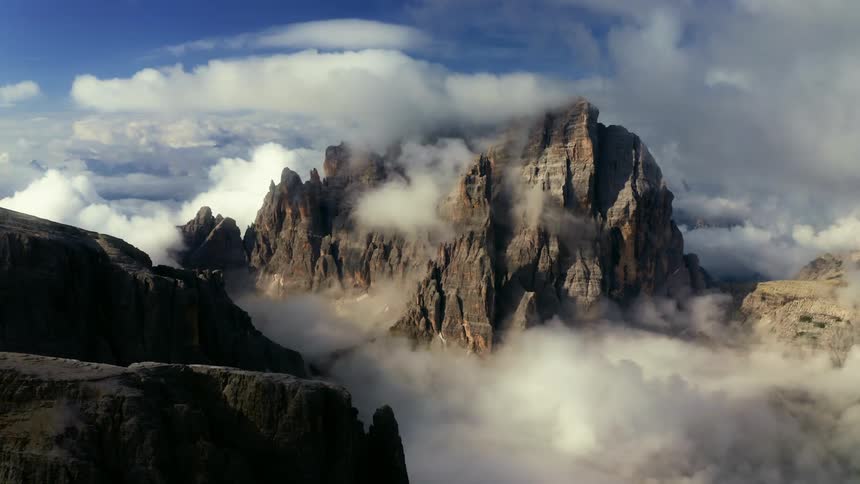 Mountain ridge high in the sky among the clouds