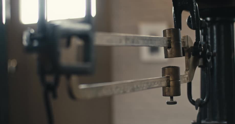 An antique scale is in the empty room