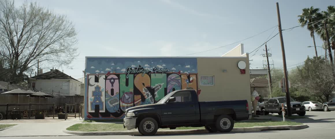 A truck sits in front of a building