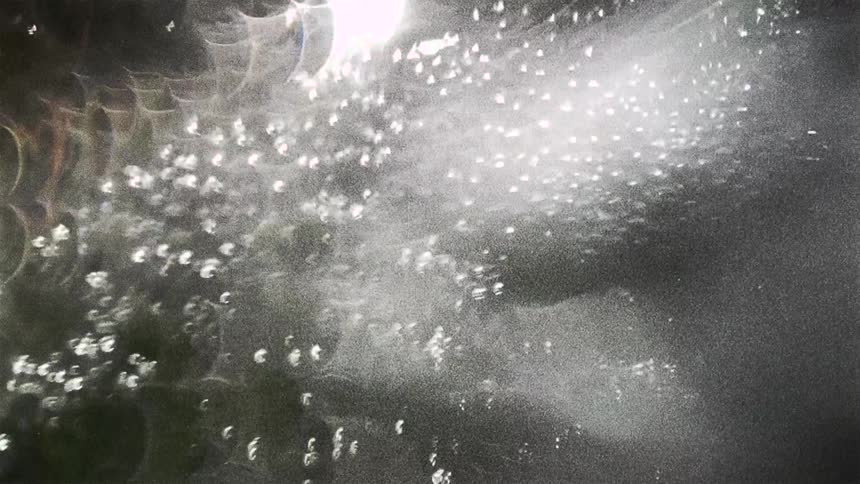 The light is reflecting off the bubbles