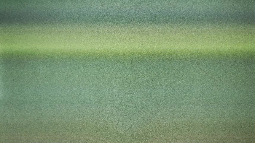 Mirror reflection of green shimmering horizontal lines caught on vintage film
