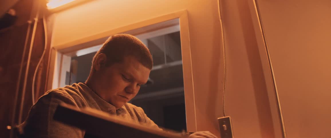 A man putting an item into a chest