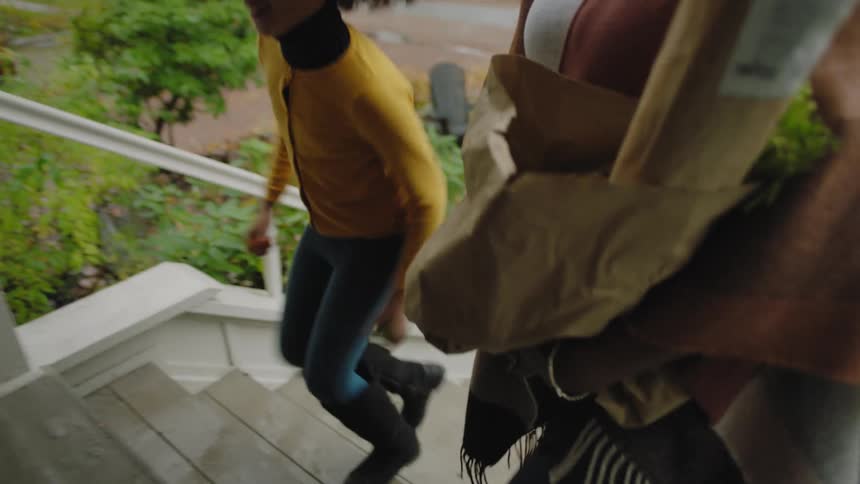 Mother and daughter are back home from buying groceries