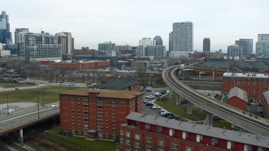 Overpass flows toward downtown passing residential buildings placed near train tracks