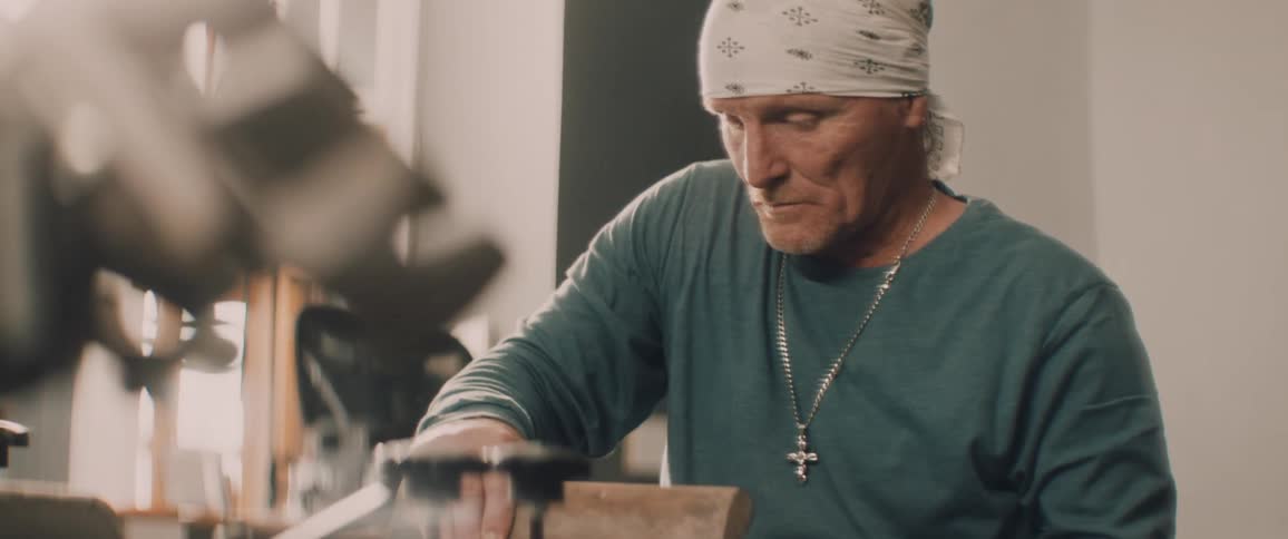 A man closes the lid on the machine