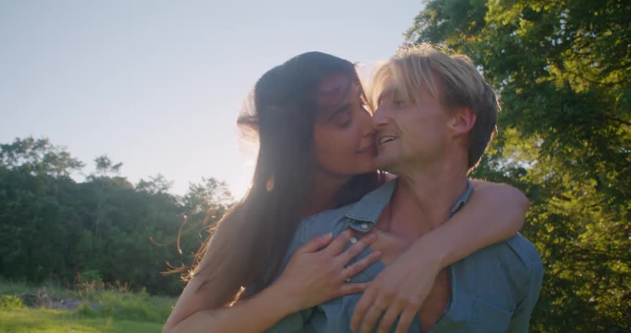 Couple kissing outdoors